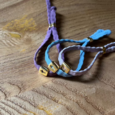 VERONA- pulsera cruz dorada elástica 7mm
